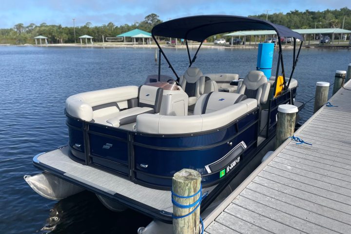 a boat is docked next to a body of water